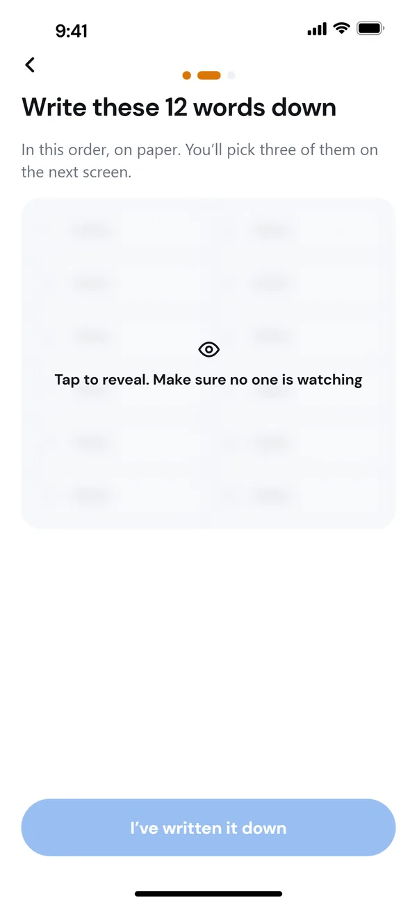 The recovery phrase, blurred until you tap